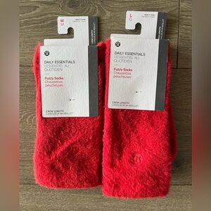 NWT Lululemon Red Fuzzy Socks in Medium and Large. Listing is for one not all.